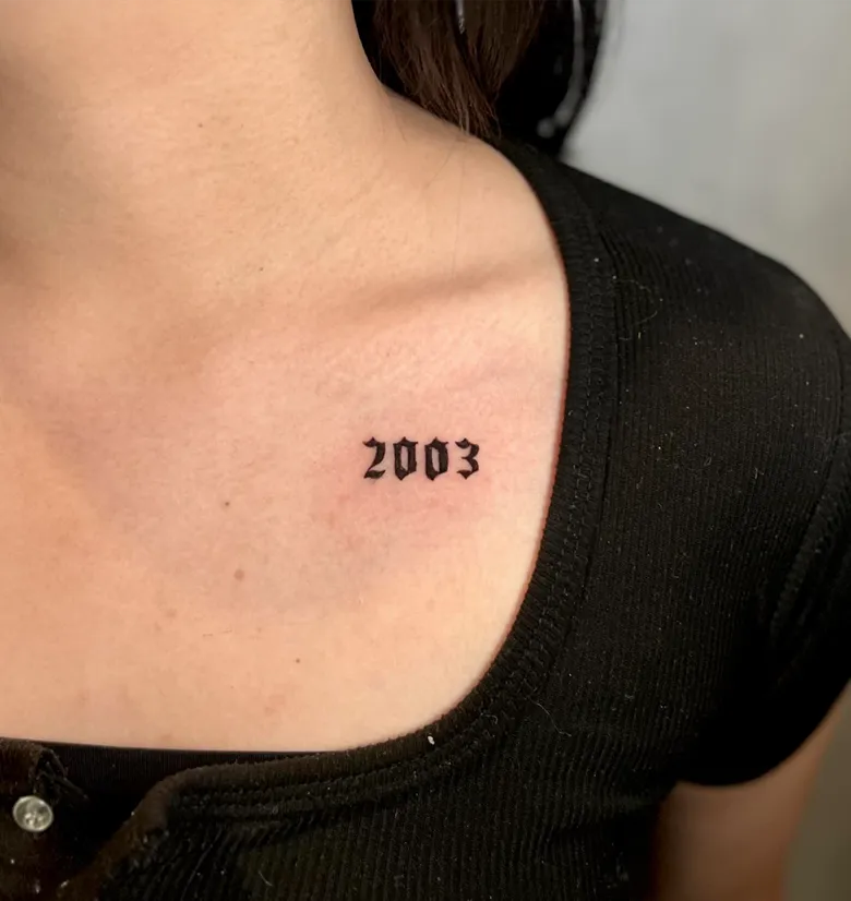 Gothic Font Birth Year Tattoo on the Collarbone