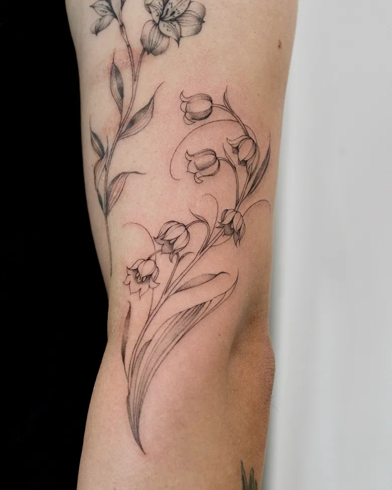 Intricate Black and Grey Lily of the Valley Tattoo