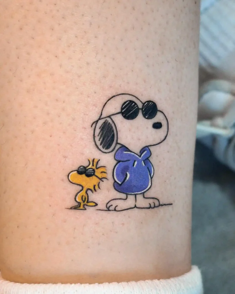Joe Cool Snoopy and Woodstock on Arm