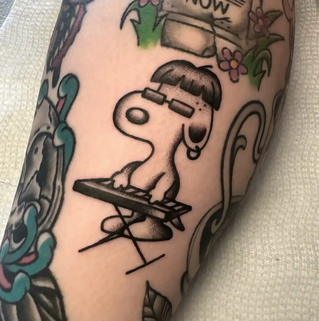 Keyboardist Snoopy with Sunglasses on Forearm