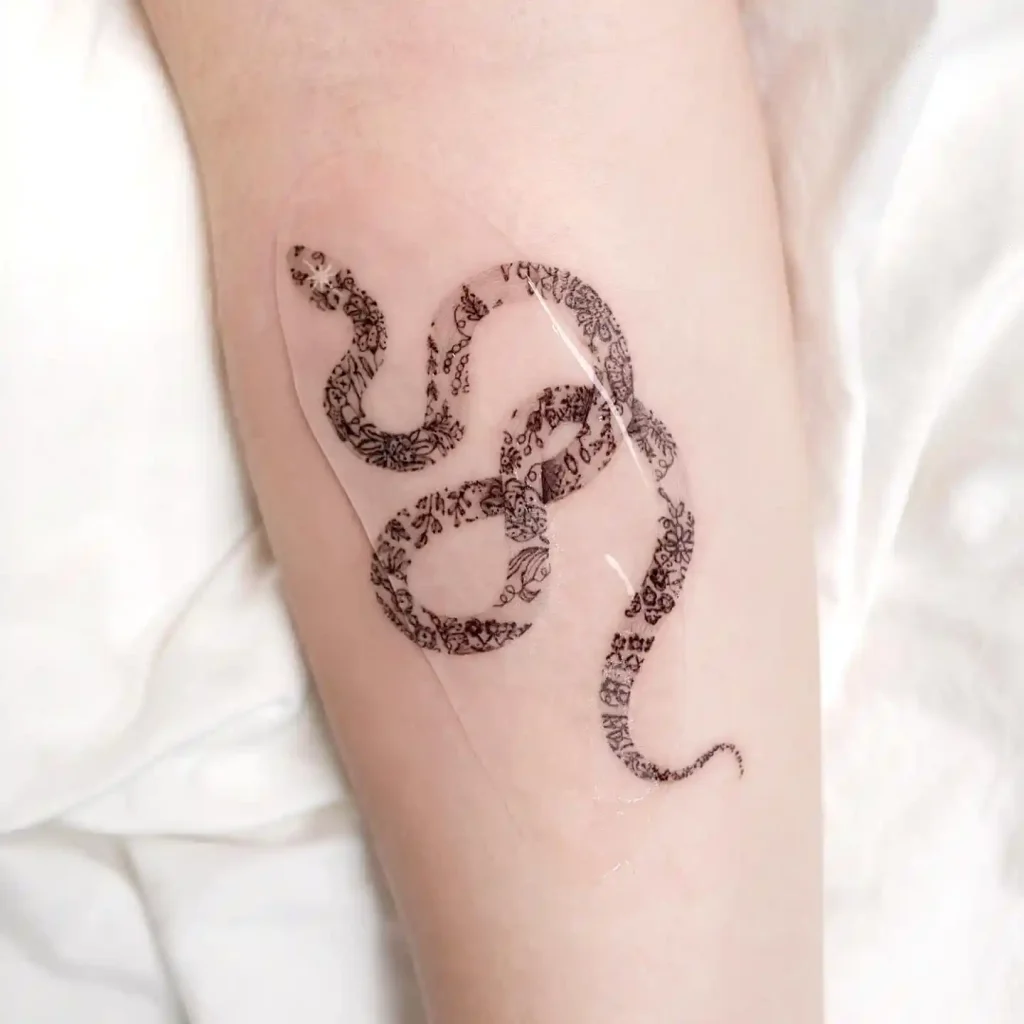 Lace Pattern Snake on Inner Forearm