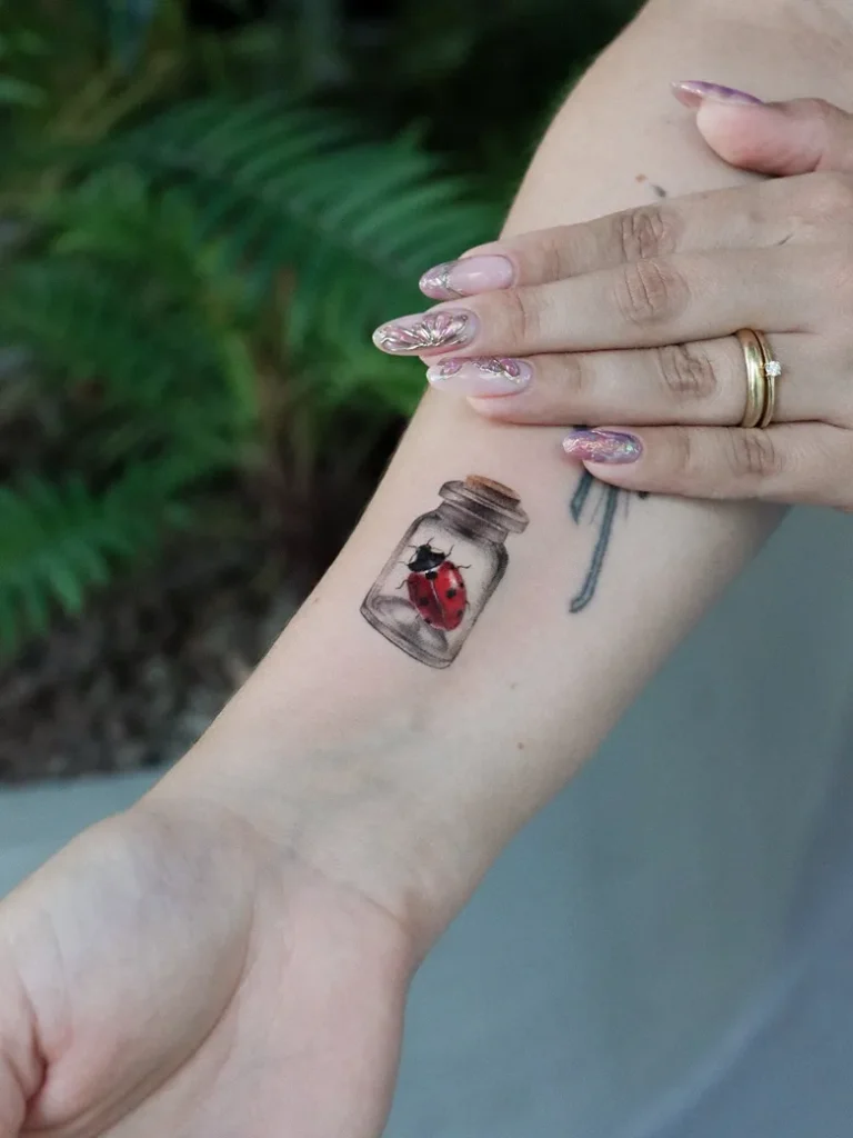 Ladybug in a Glass Jar Tattoo