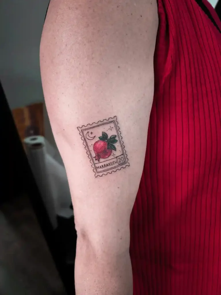 Marrakech Postage Stamp Pomegranate on Upper Arm