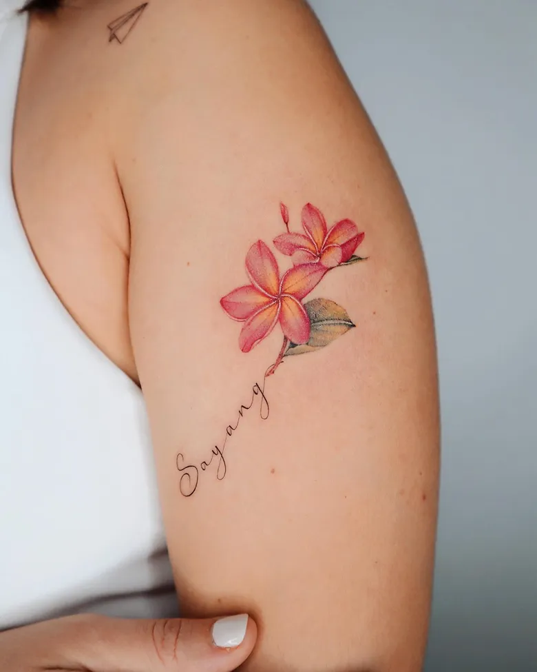 Script and Plumeria Shoulder Tattoo