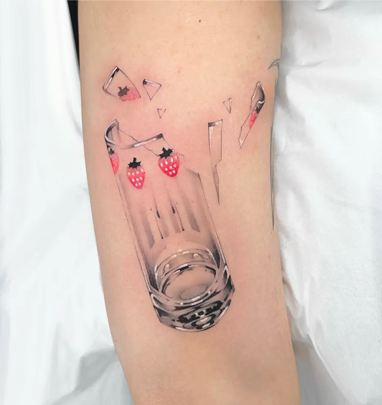 Playful Broken Strawberry Glass Tattoo