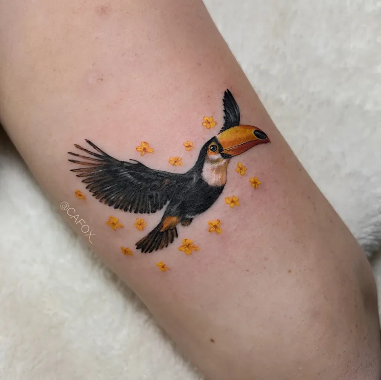 Realistic Flying Toucan Tattoo