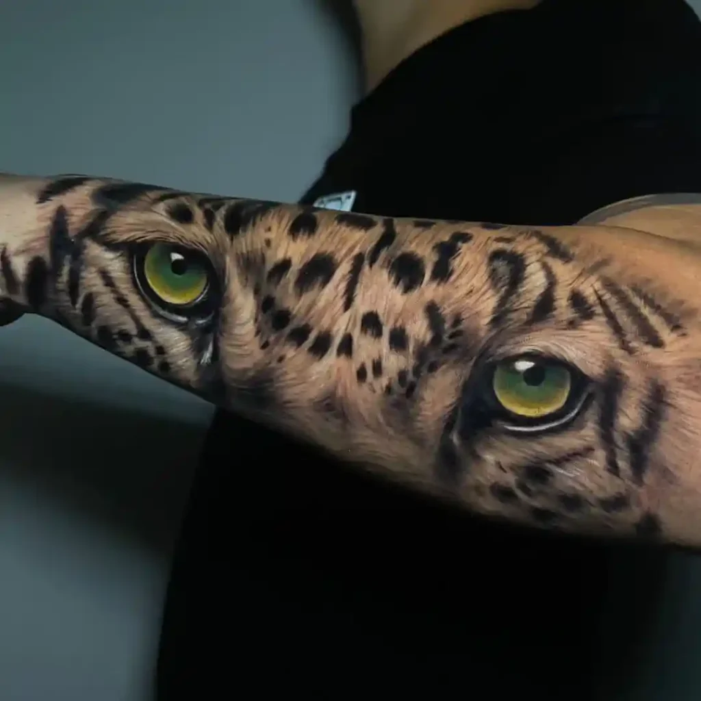 Realistic Jaguar Eyes on Inner Forearm