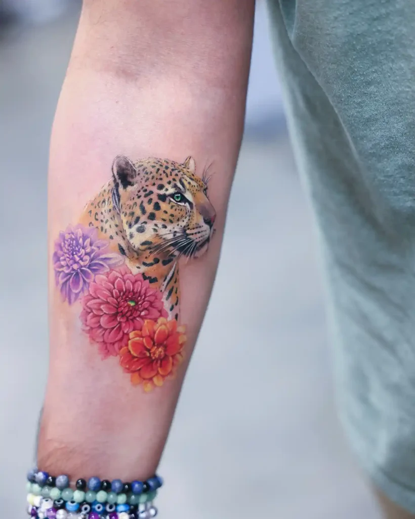 Realistic Jaguar with Vibrant Dahlias on Inner Forearm