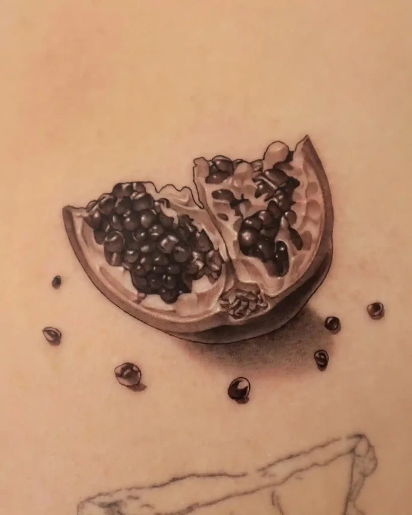 Realistic Open Pomegranate on Inner Arm
