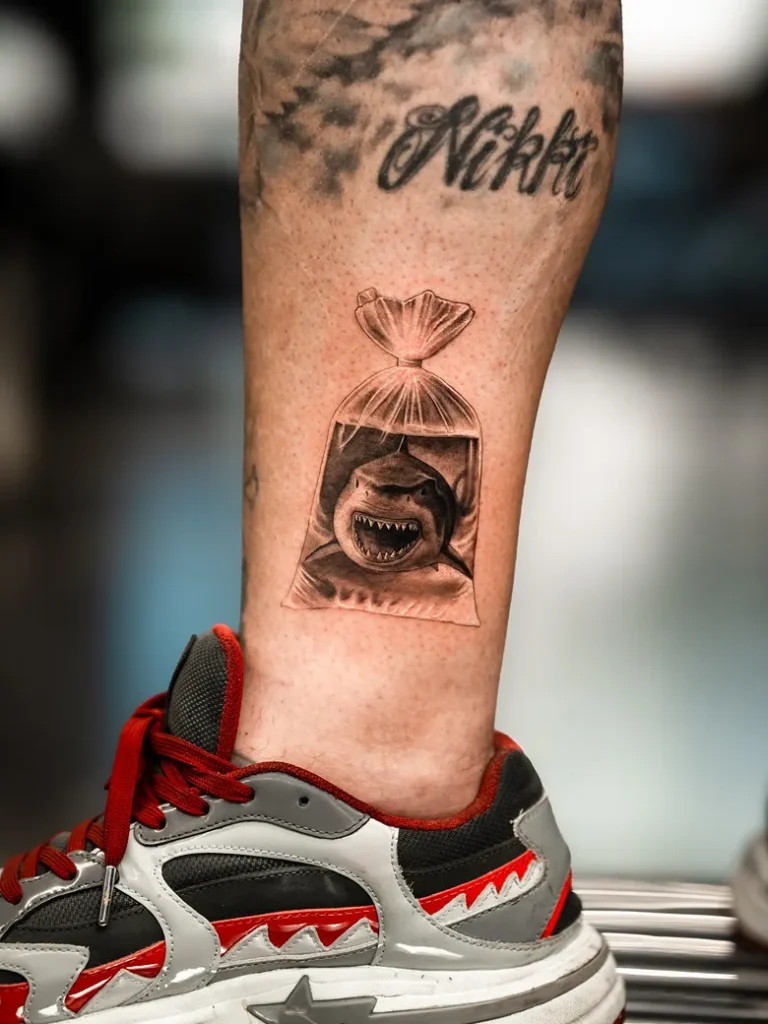 Realistic Shark in Plastic Bag Tattoo