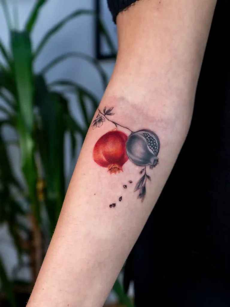 Red and Grey Pomegranate Branch on Inner Forearm