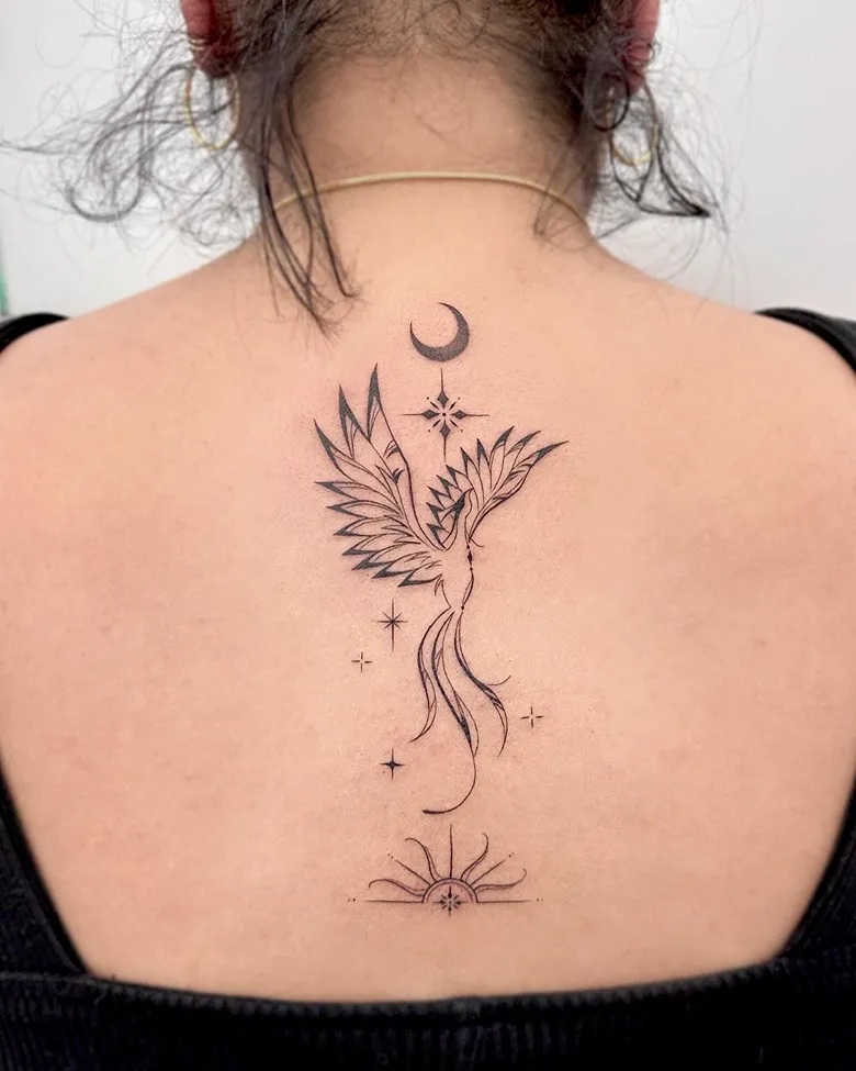 Serene Celestial Phoenix Spine Tattoo