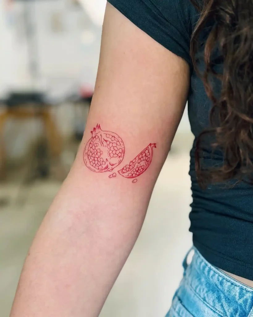 Sliced Red Ink Pomegranate on Upper Arm