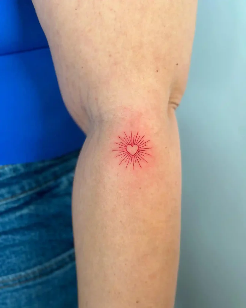 Small Red Heart with Sunburst on Inner Arm