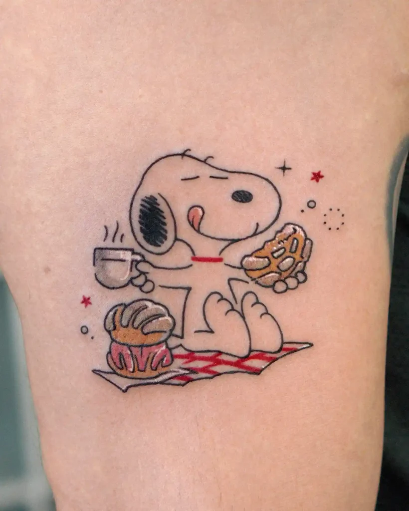 Snoopy Eating Pan Dulce on Upper Arm