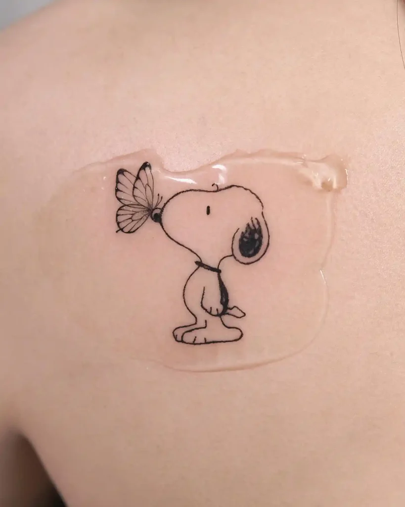 Snoopy and Butterfly Fine Line Tattoo on Upper Back