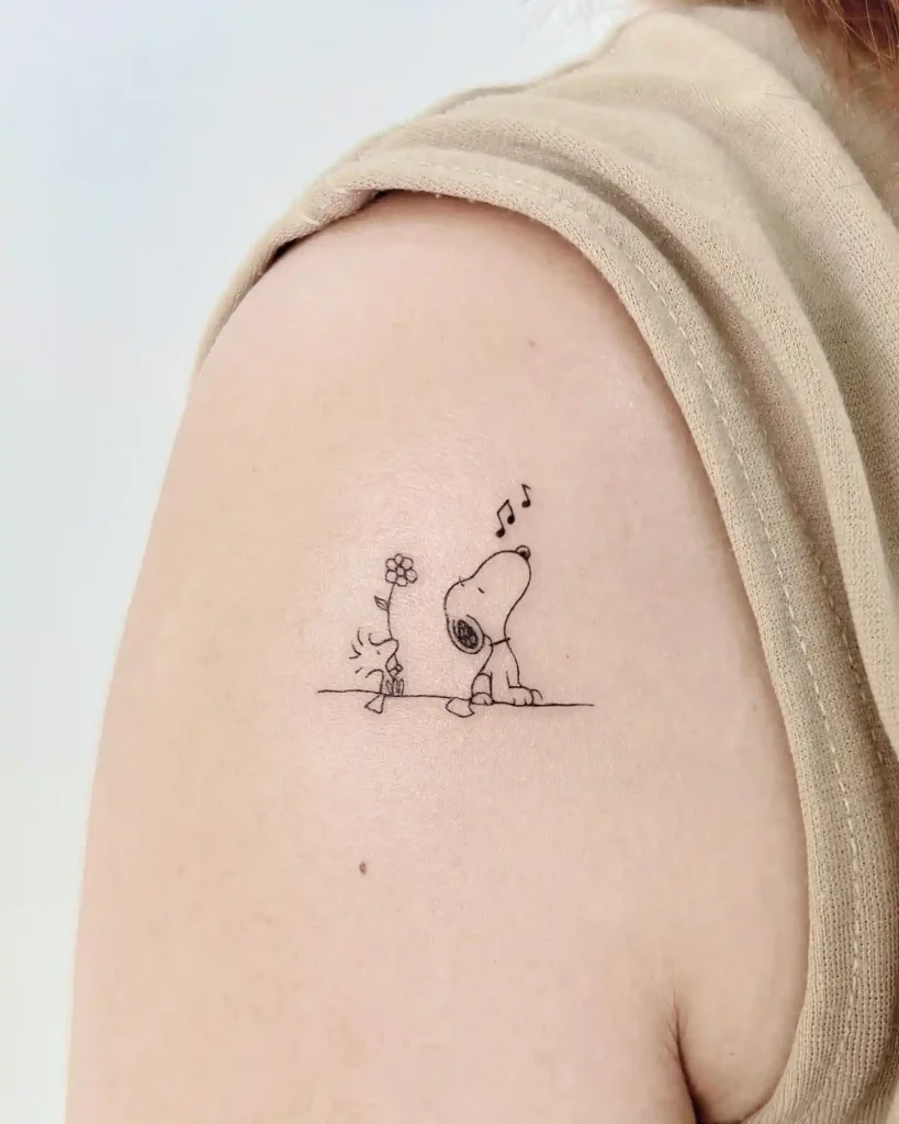 Snoopy and Woodstock Singing with Flower on Upper Arm