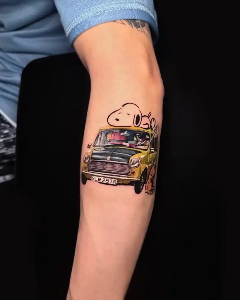 Snoopy and Woodstock on Yellow Vintage Car on Forearm