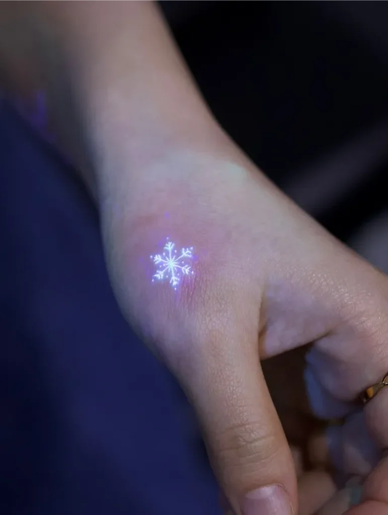 Snowflake Hand UV Tattoo