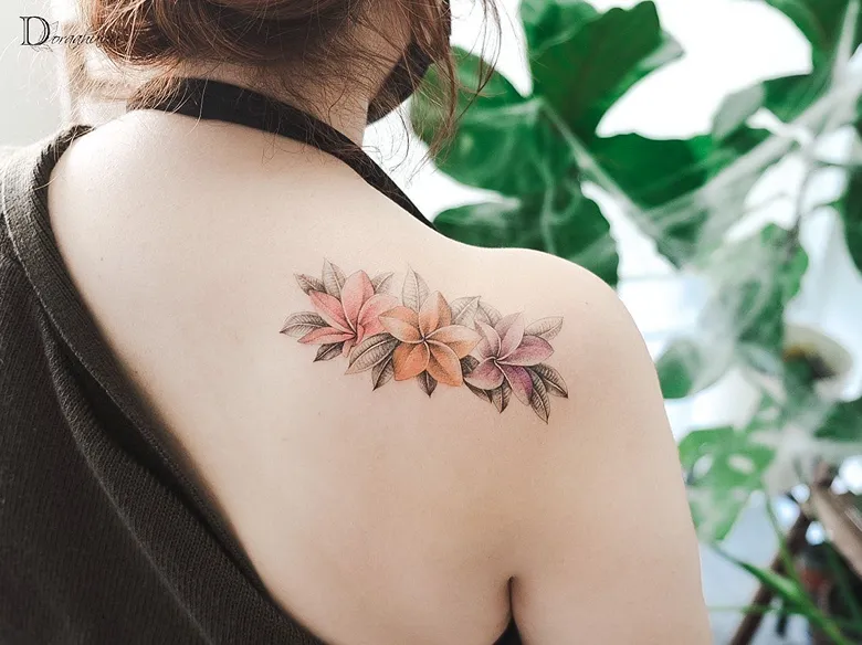 Soft Color Plumeria Shoulder Cluster Tattoo