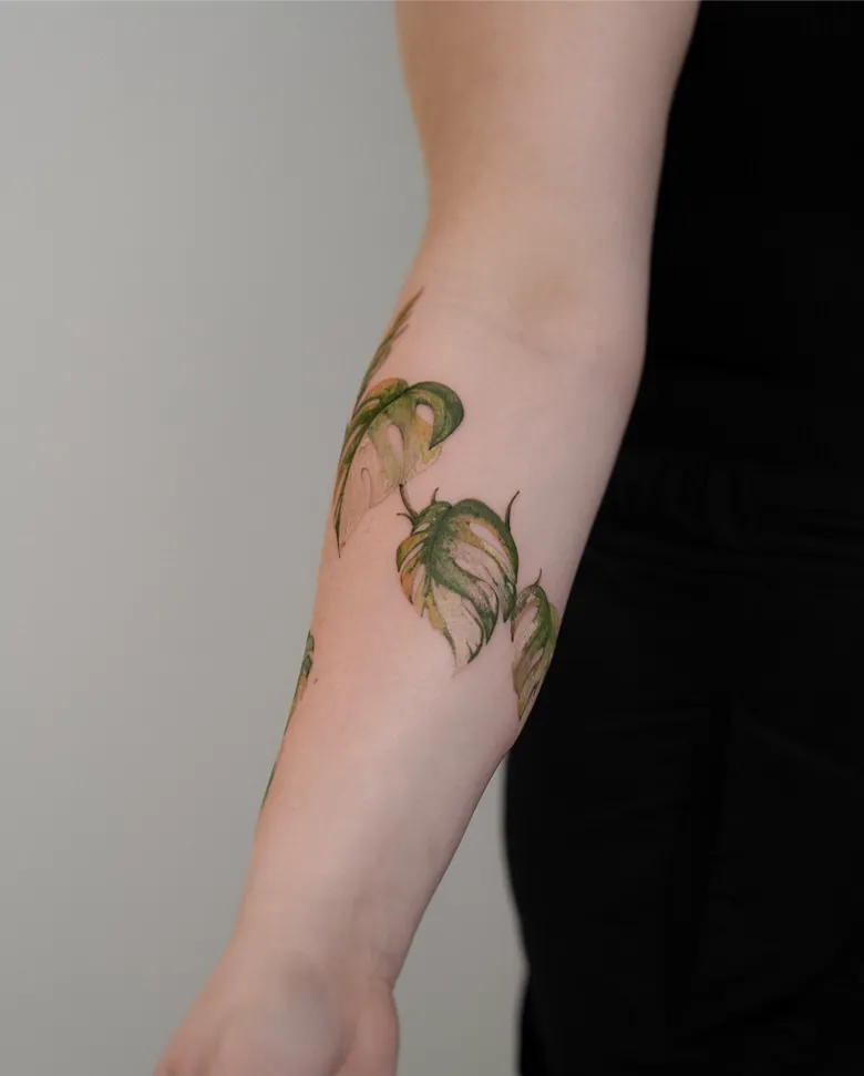 Soft Watercolor Monstera Vine Forearm Tattoo