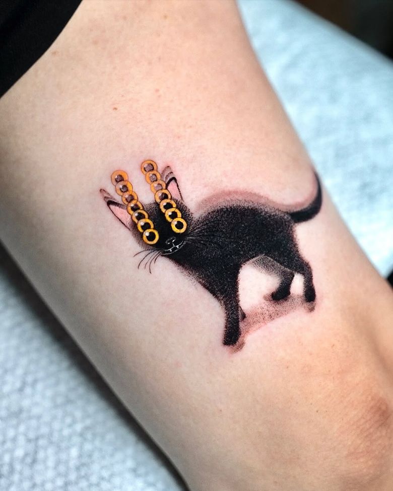 Surreal Black Cat Tattoo with Golden Eyes