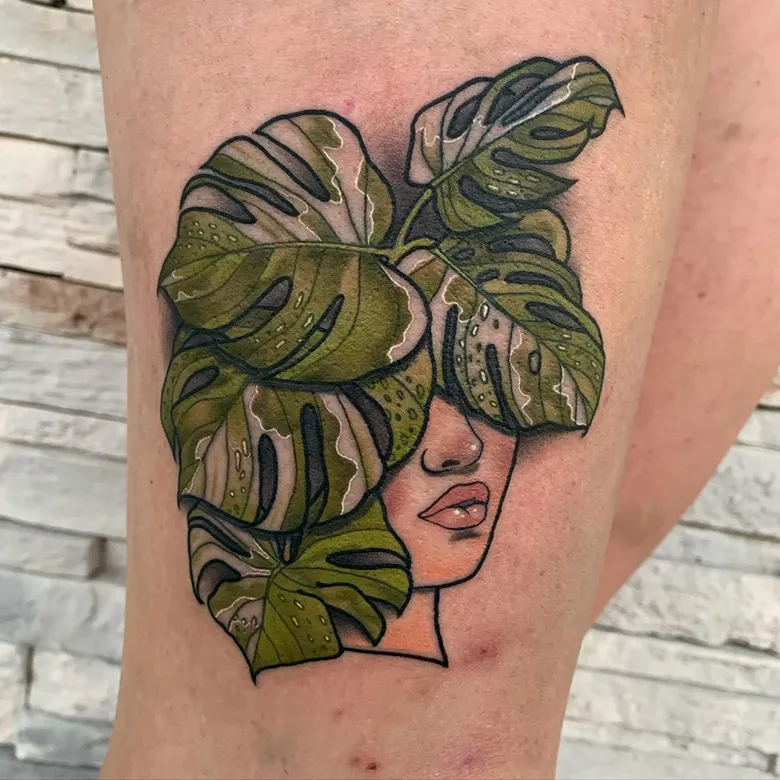 Surreal Woman Face Monstera Tattoo