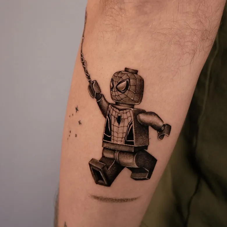 Swinging Spider Man Lego Tattoo Design