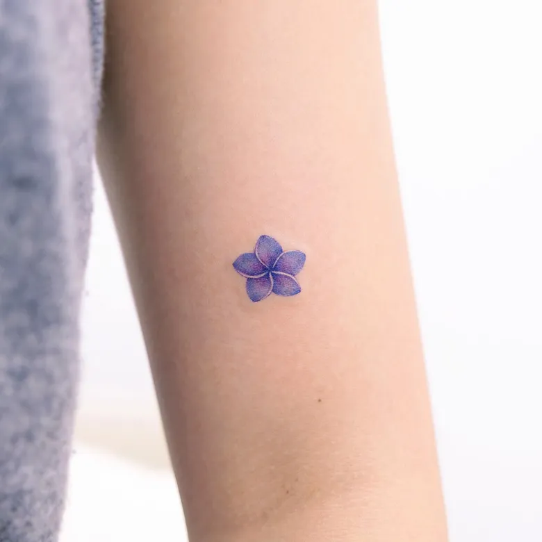 Tiny Blue Plumeria Minimal Tattoo