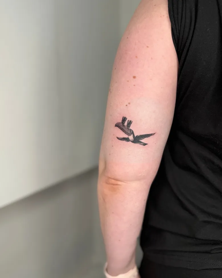 Tiny Flying Toucan With Guinness Glass Tattoo