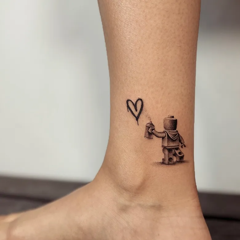 Tiny Graffiti Artist Lego Tattoo