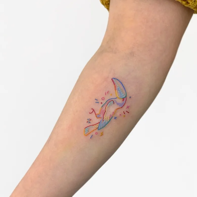 Tiny Pastel Toucan Tattoo