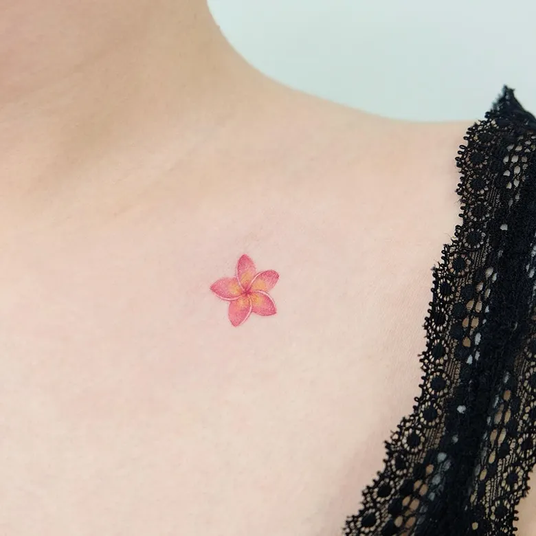 Tiny Pink Plumeria Collarbone Tattoo