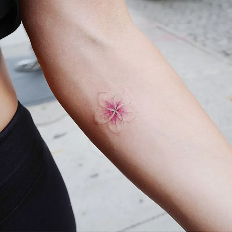 Tiny Pink Plumeria Wrist Tattoo