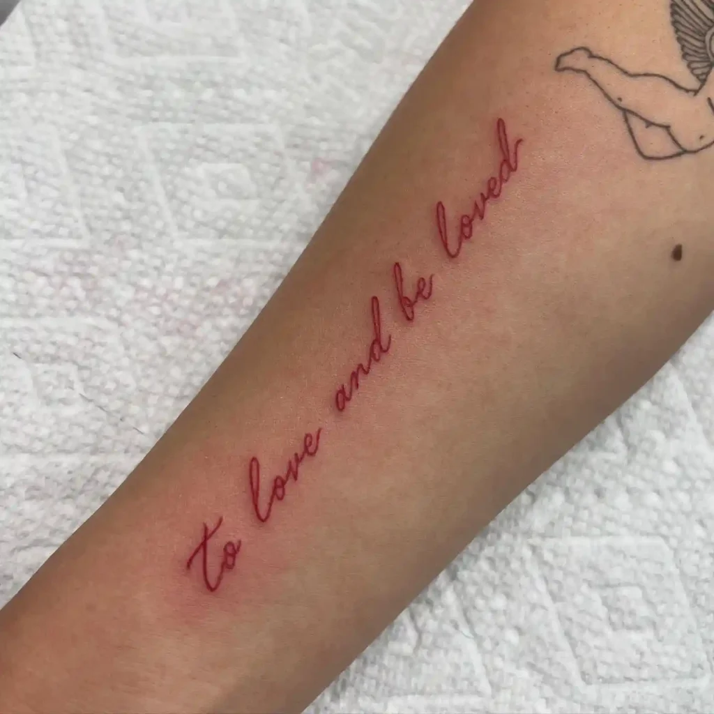 To Love and Be Loved Script on Inner Forearm