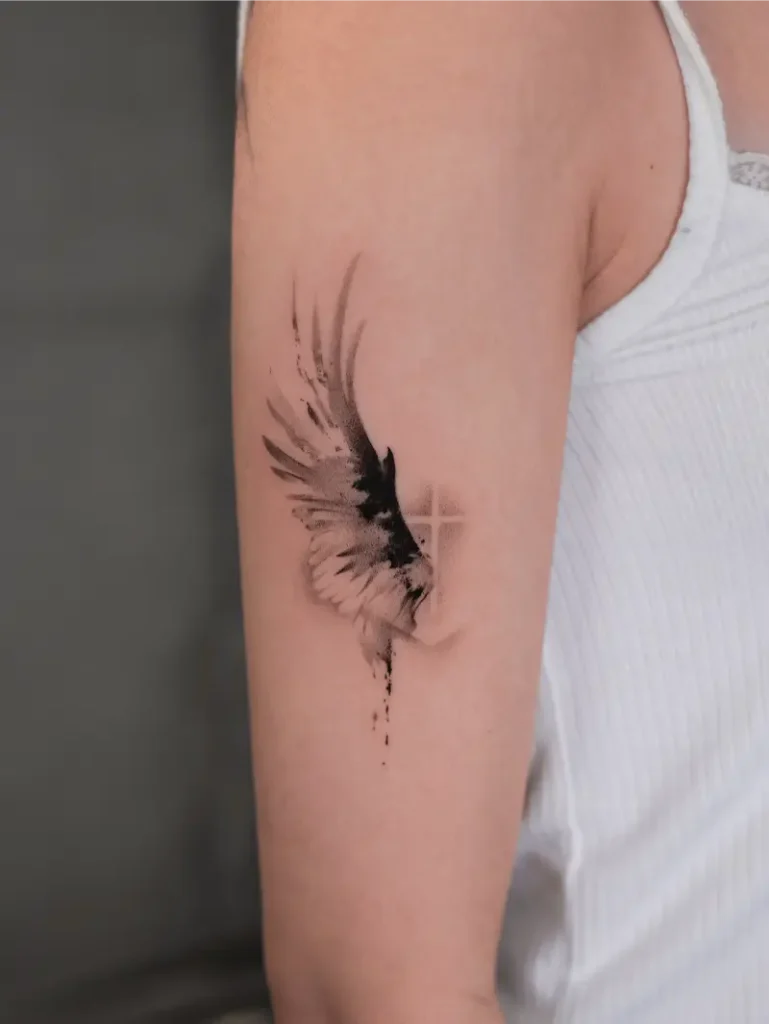 Abstract Wing Cross Tattoo