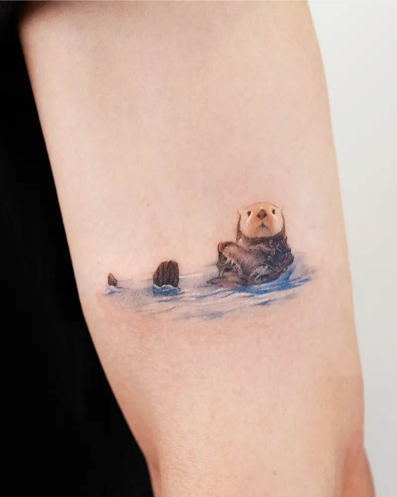 Adorable Mini Sea Otter Tattoo