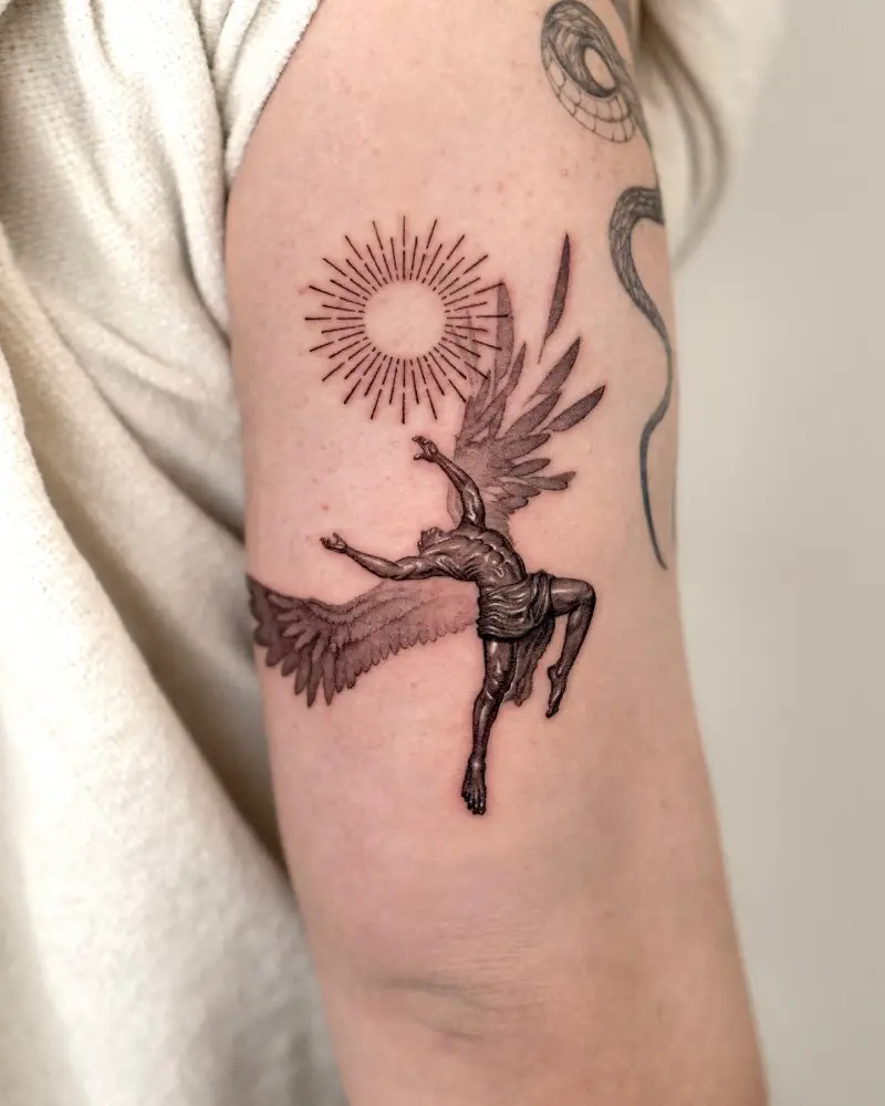 Black and Grey Icarus Sun Tattoo