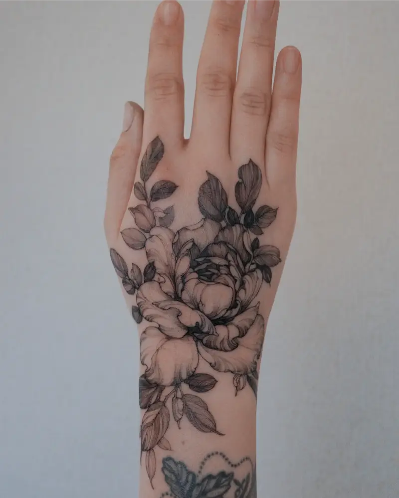 Black and Grey Peony Hand Tattoo