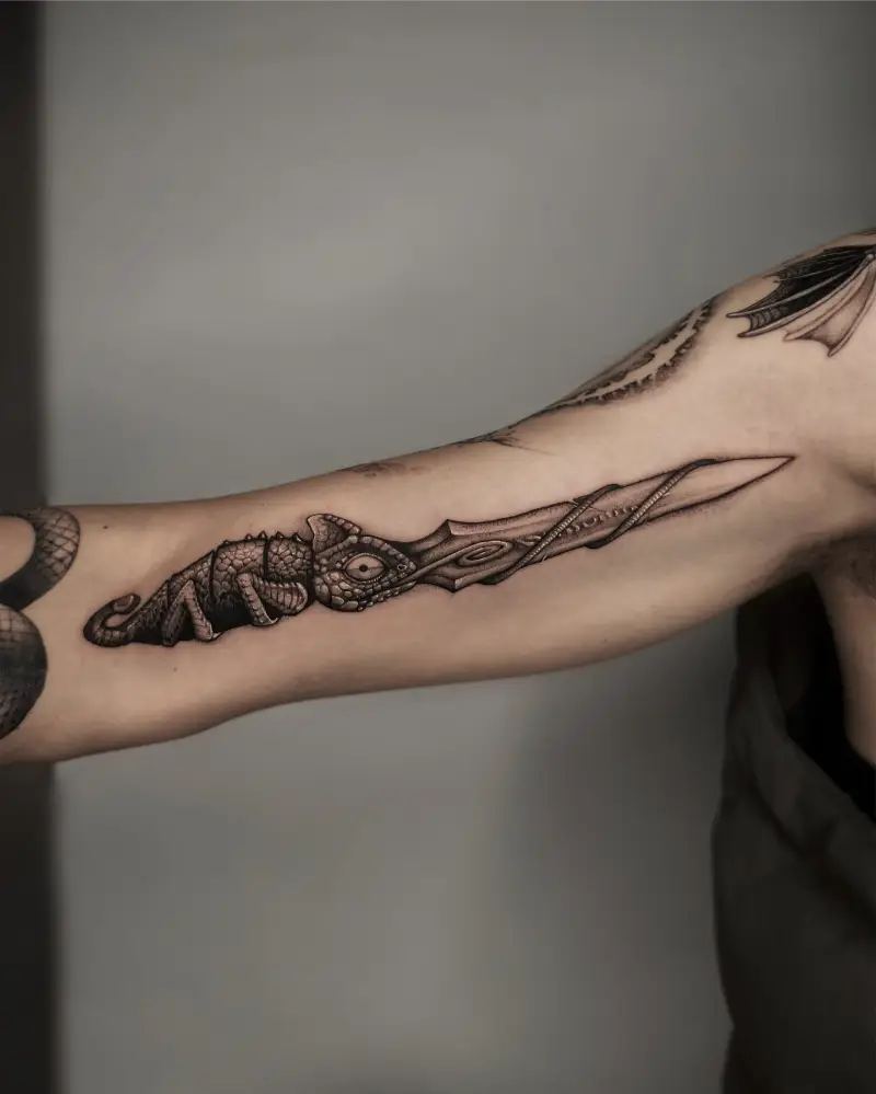 Blackwork Chameleon & Dagger Tattoo