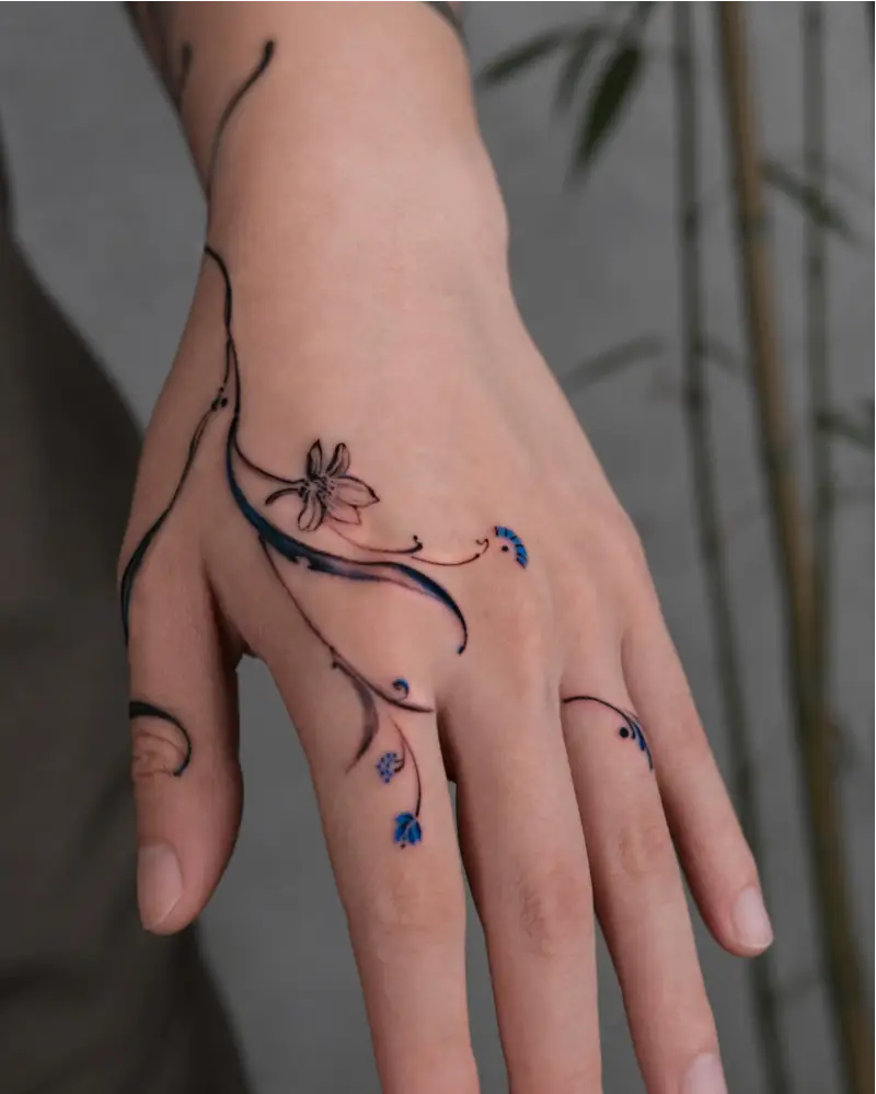 Blue Floral Fine Line Hand Tattoo