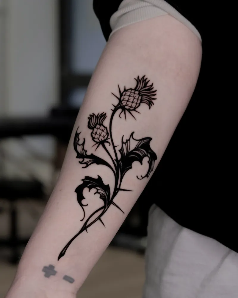 Bold Blackwork Thistle Tattoo