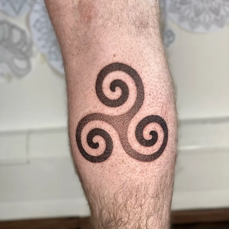 Bold Handpoked Triskele Spiral Tattoo