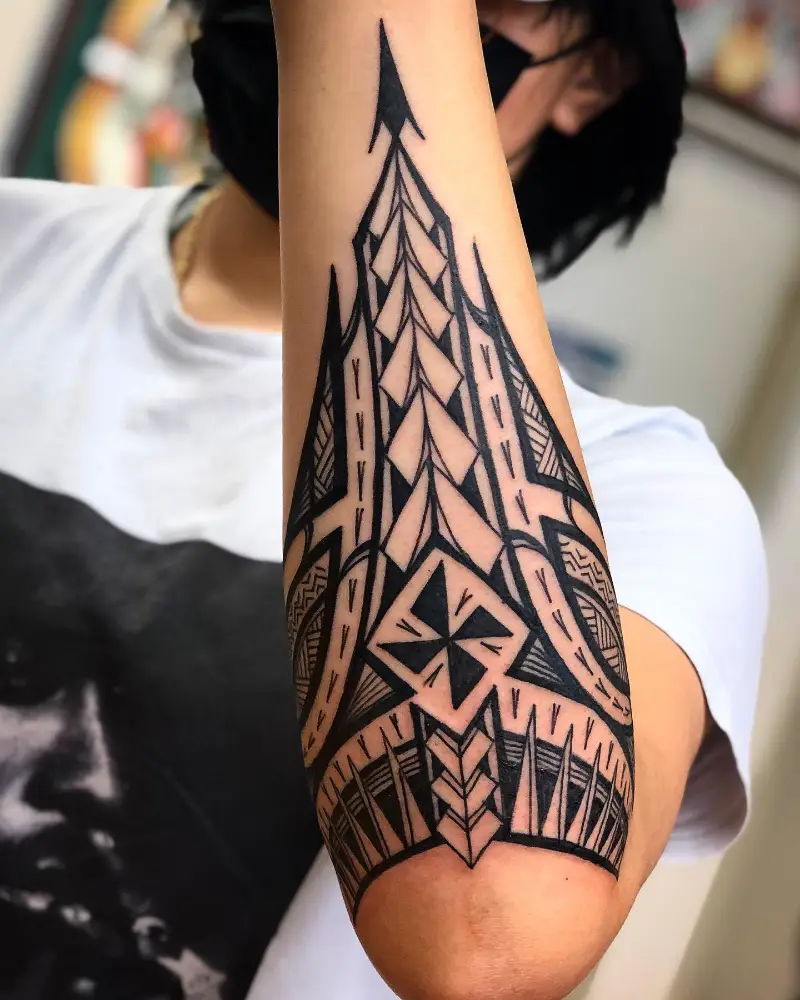 Bold Polynesian Spear Elbow Tattoo