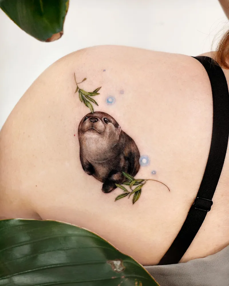 Botanical Watercolor Otter Tattoo