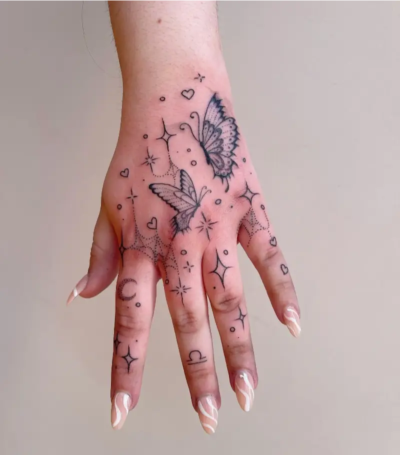 Butterfly and Celestial Hand Tattoo