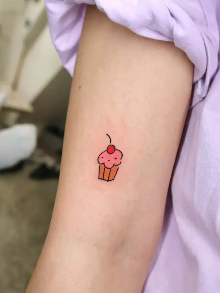 Cartoonish Cherry Cupcake Tattoo