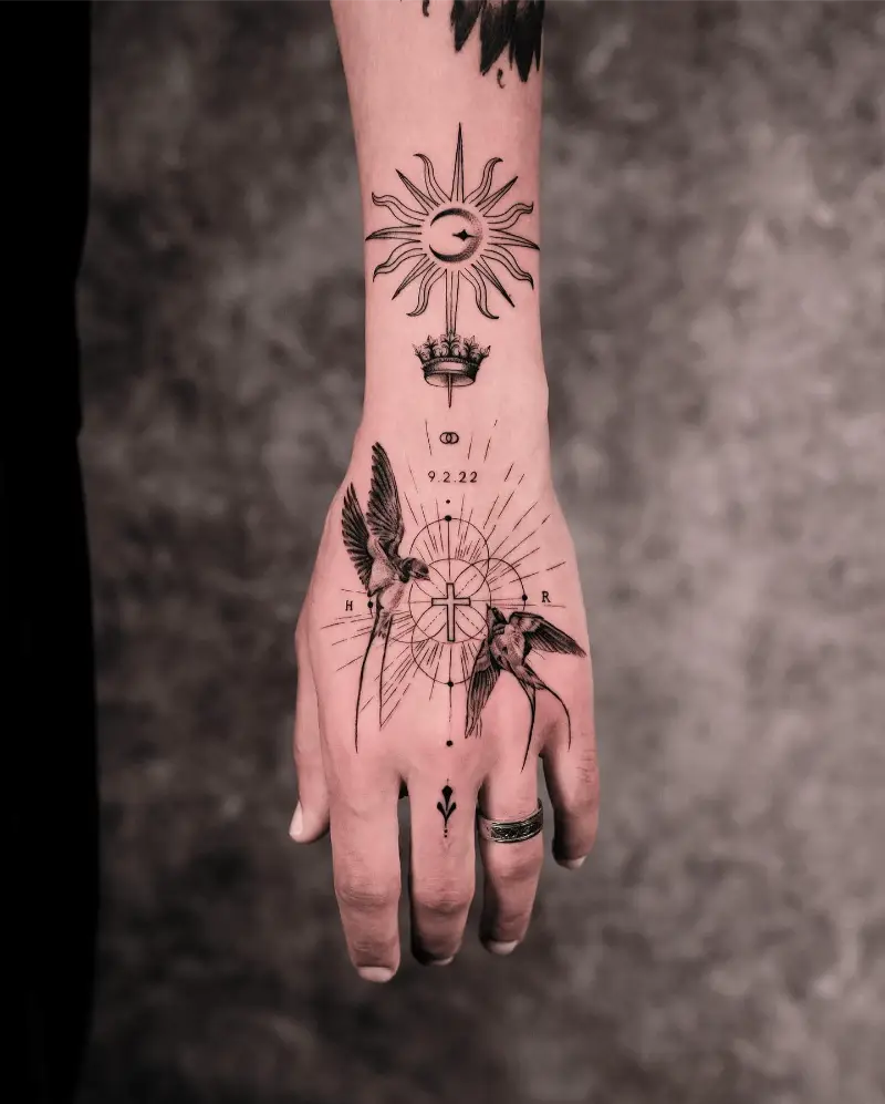 Celestial Cross and Swallow Hand Tattoo