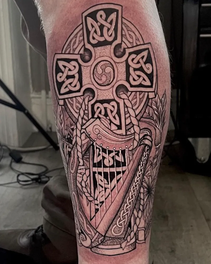 Celtic Cross And Harp Sleeve Tattoo