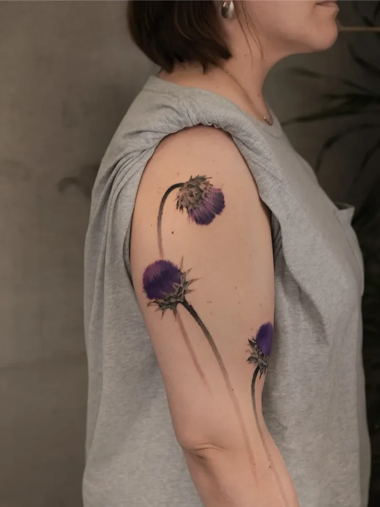 Contemporary Watercolor Thistle Shoulder Tattoo